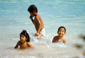 Wilcommen, No. 0021 Three Local Children Play in the Aquamarine Lagoon